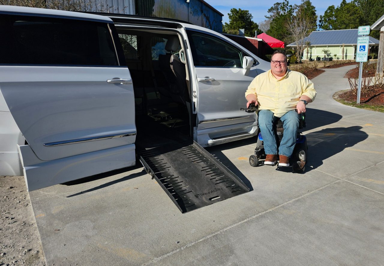 man in wheelchair with accessible van