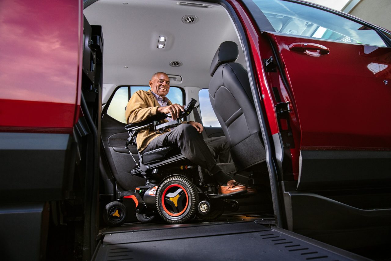 a man getting ready to drive his wheelchair SUV