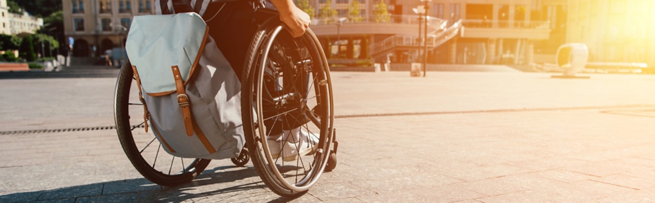 Image of man in wheelchair from behind