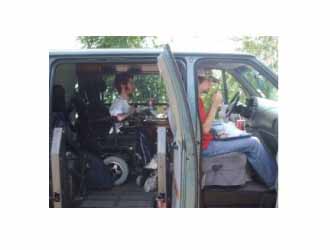 Scott Drotar riding in a wheelchair van