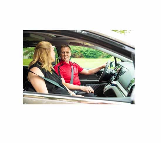 Man and woman sitting in a car.