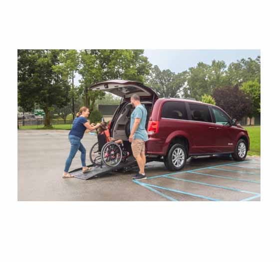Family using the rear entry ramp on the Dodge grand caravan Wheelchair van rear entry
