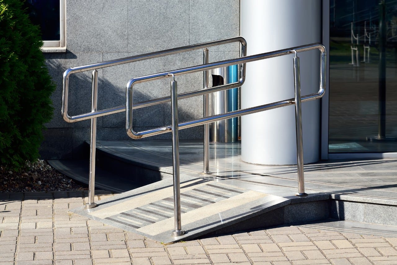 Ramp Ramp for wheelchair entry with metal handrails