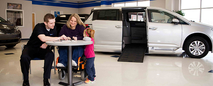 family buying a wheelchair van