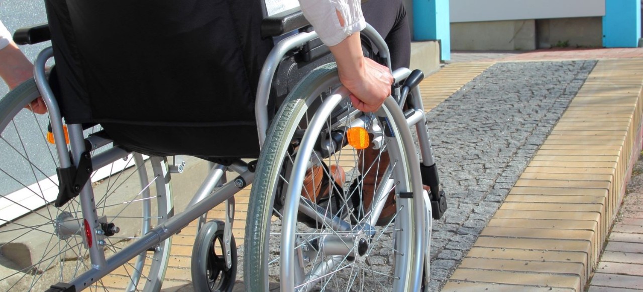 Wheelchair User Using a Ramp 