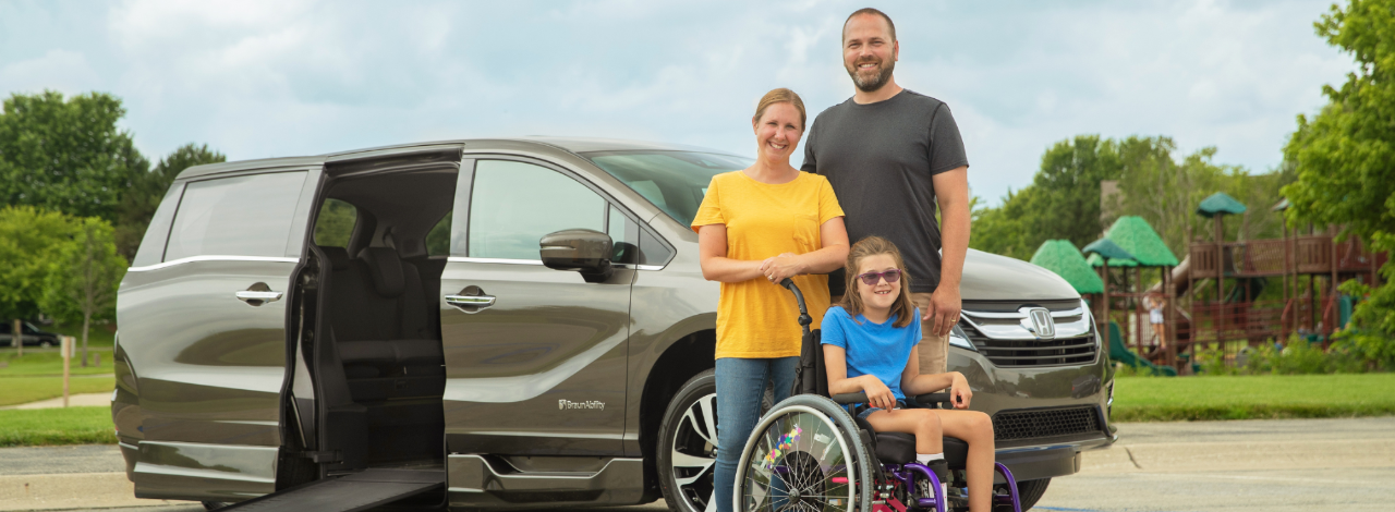 Family infront of a Wheelchair Accessible Van