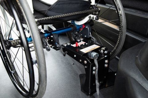 Wheelchair securement and tiedowns for full-size vans