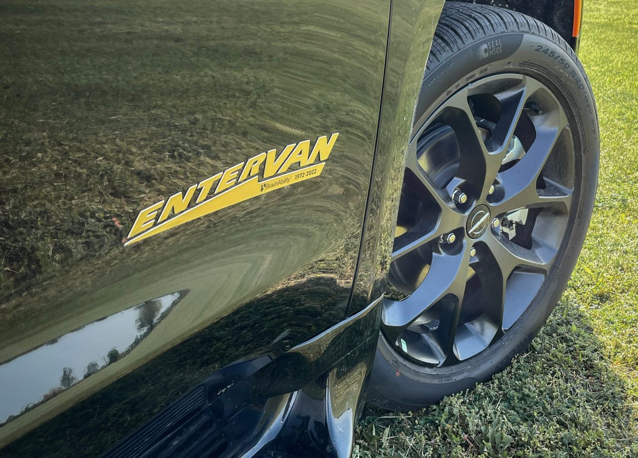 Close up of the gold entervan badge on the side of the BraunAbility entervan