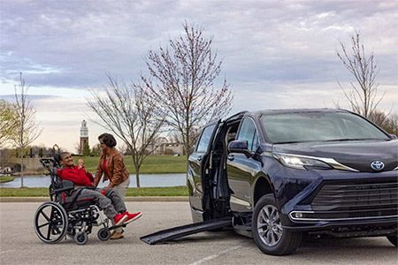 family next to the toyota hybrid 