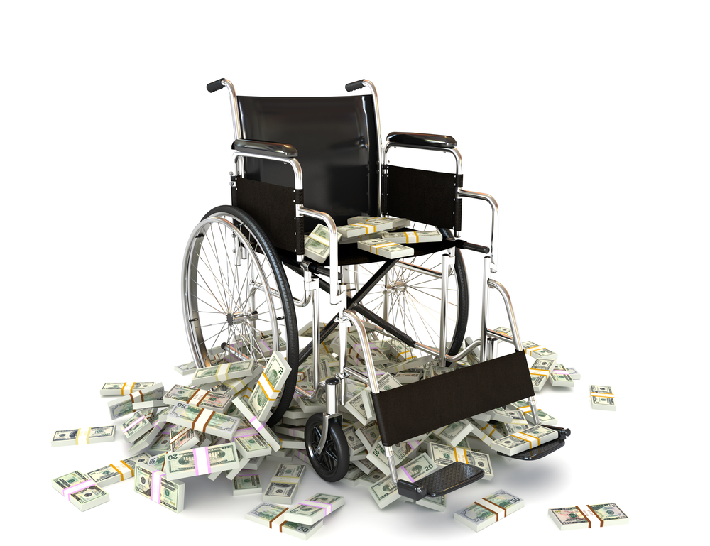 a manual wheelchair sitting on top of a pile of money