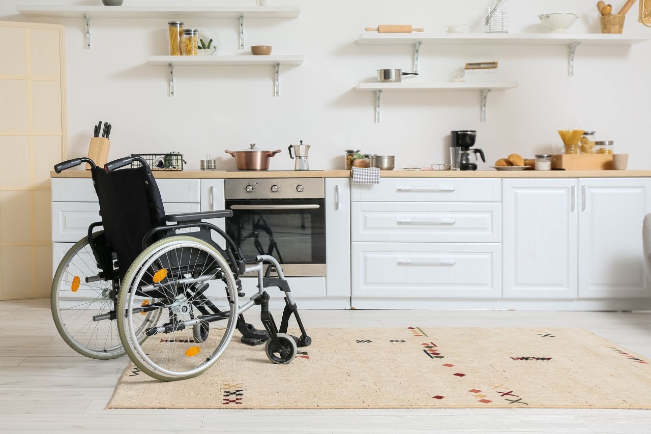 Empty wheelchair in a kitchen