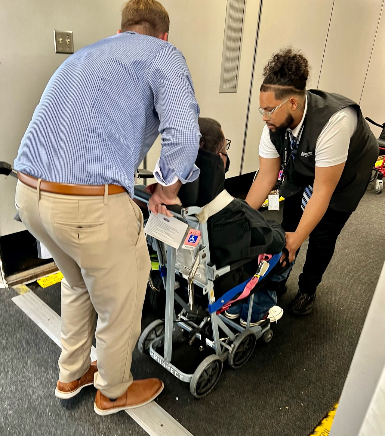 wheelchair user getting on airplane