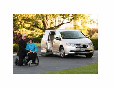 Universal Design 101 with Rosemarie Rossetti, Ph.D. sitting next to her Honda and her husband