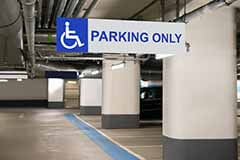 Handicap parking only sign in a parking garage