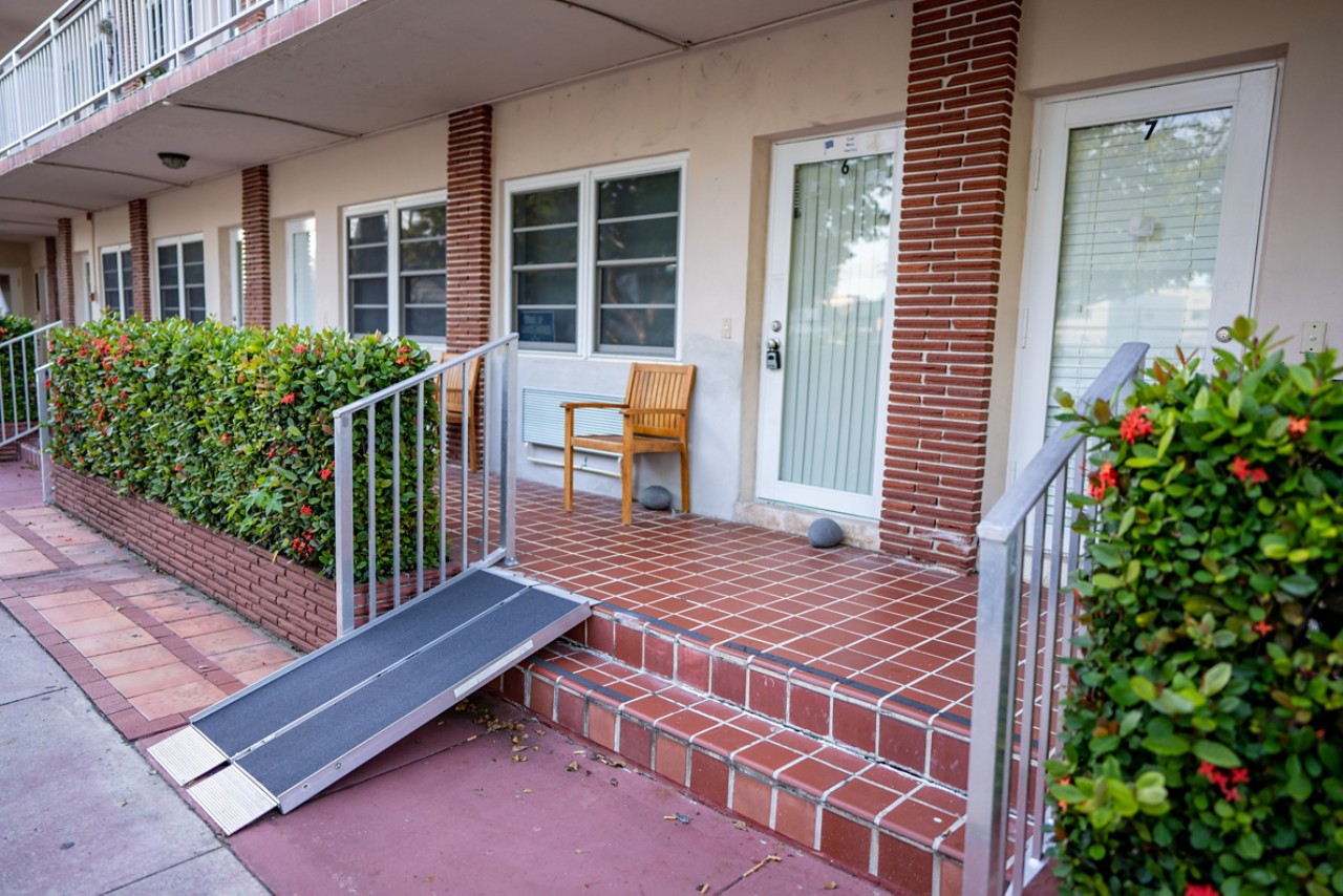 Apartment with handicapped wheelchair ramp by the door