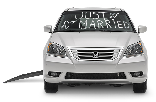 handicap van with just got married on front windsheild