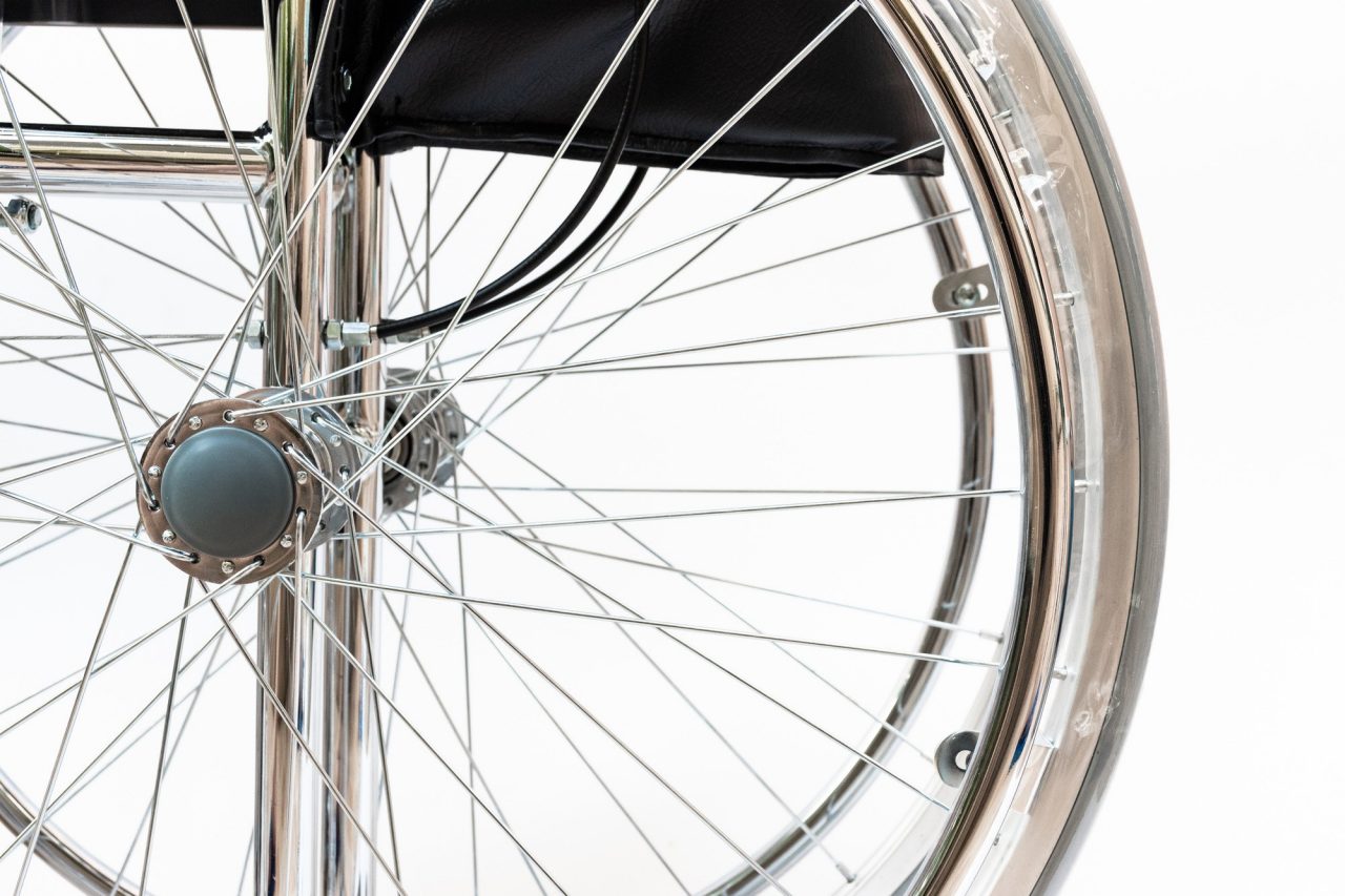 close-up of wheelchair on white background