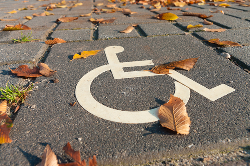 disabled parking permit sign painted on the street