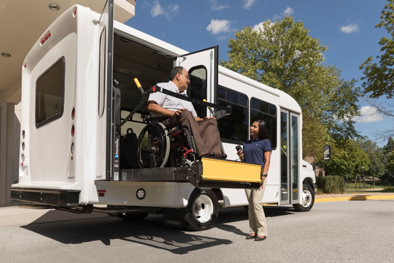 a man on a century scooter lift for van