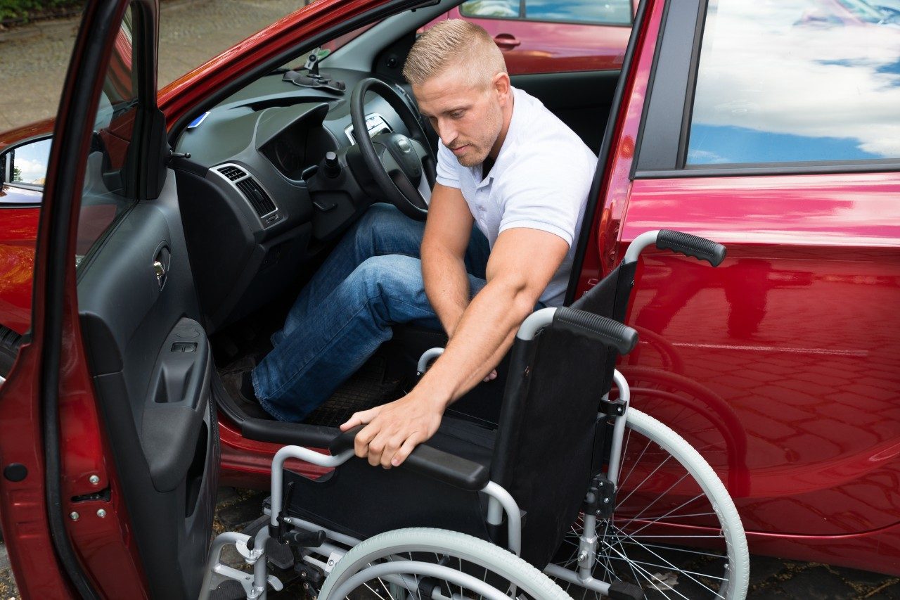 Man in car holding keys