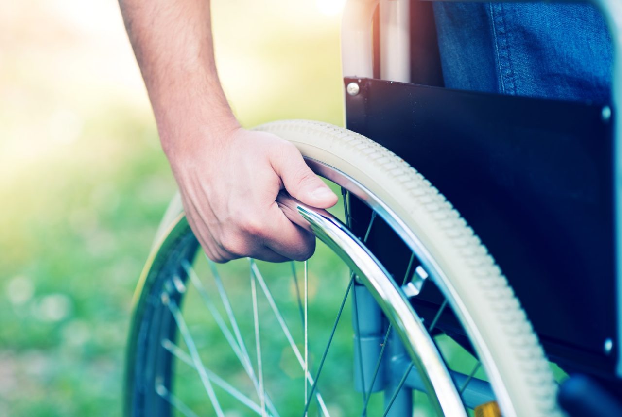 Detail of a disabled man on a wheelchair