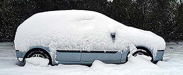 Man and woman sitting in a car.