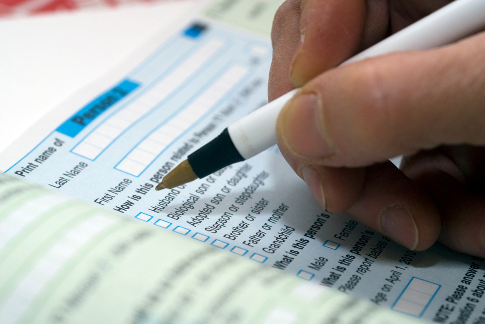 a person taking a census with a pen