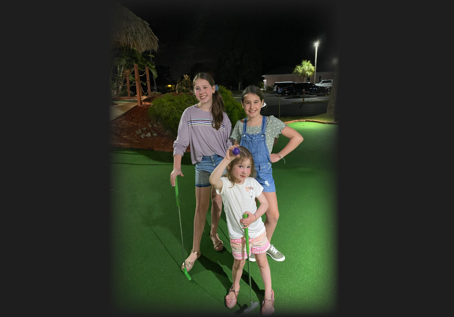 girls playing mini golf