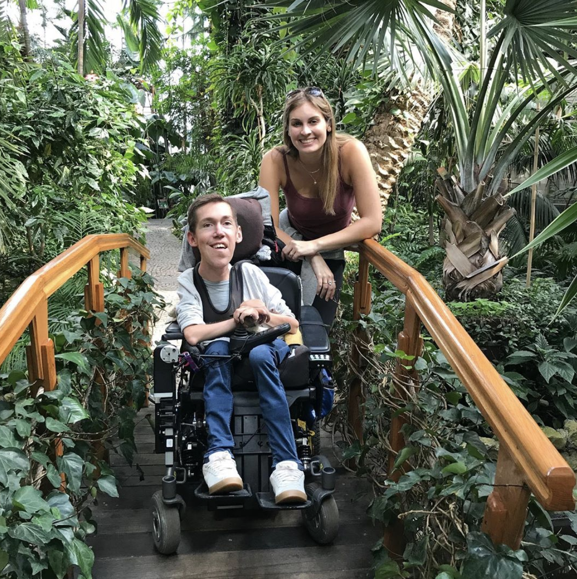 Shane Burcaw and Hannah Aylward crossing a bridge Shane Burcaw and Hannah Aylward crossing a bridge