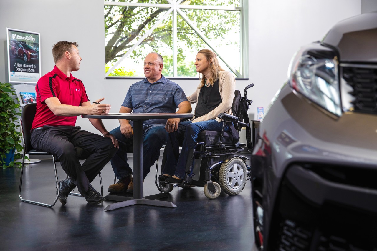 couple sitting at a mobility consultation working with a certified mobility consultant 