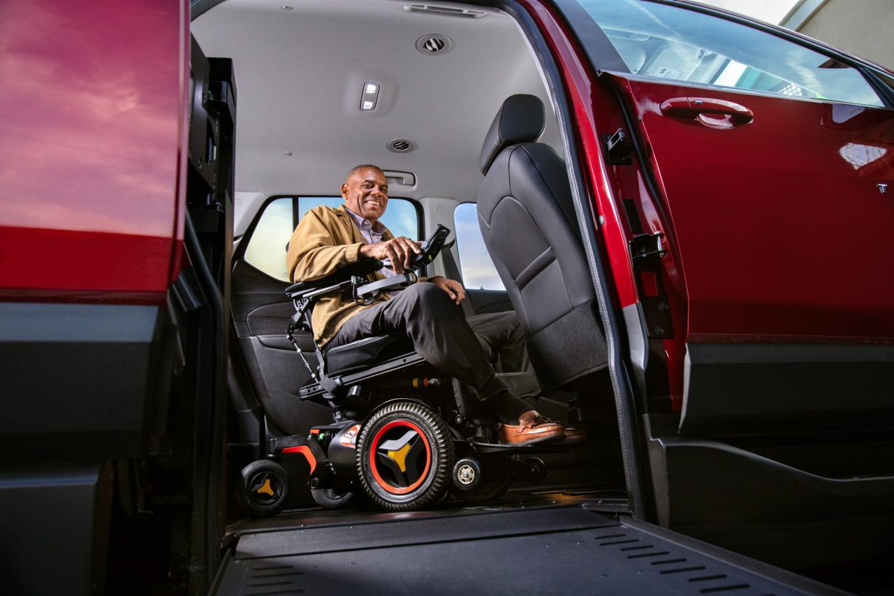 a man getting ready to drive his wheelchair SUV a man getting ready to drive his wheelchair SUV