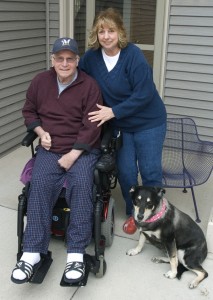 Linda and Lee Sippel sit on their front porch with their dog at their feet Linda and Lee Sippel sit on their front porch with their dog at their feet
