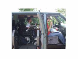 Scott Drotar riding in a wheelchair van Scott Drotar riding in a wheelchair van