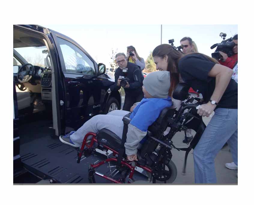 Boy in wheelchair receives a van donation|van donation|gym|wheelchair van donation