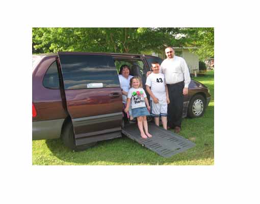 parents and their kids in a wheelchair van