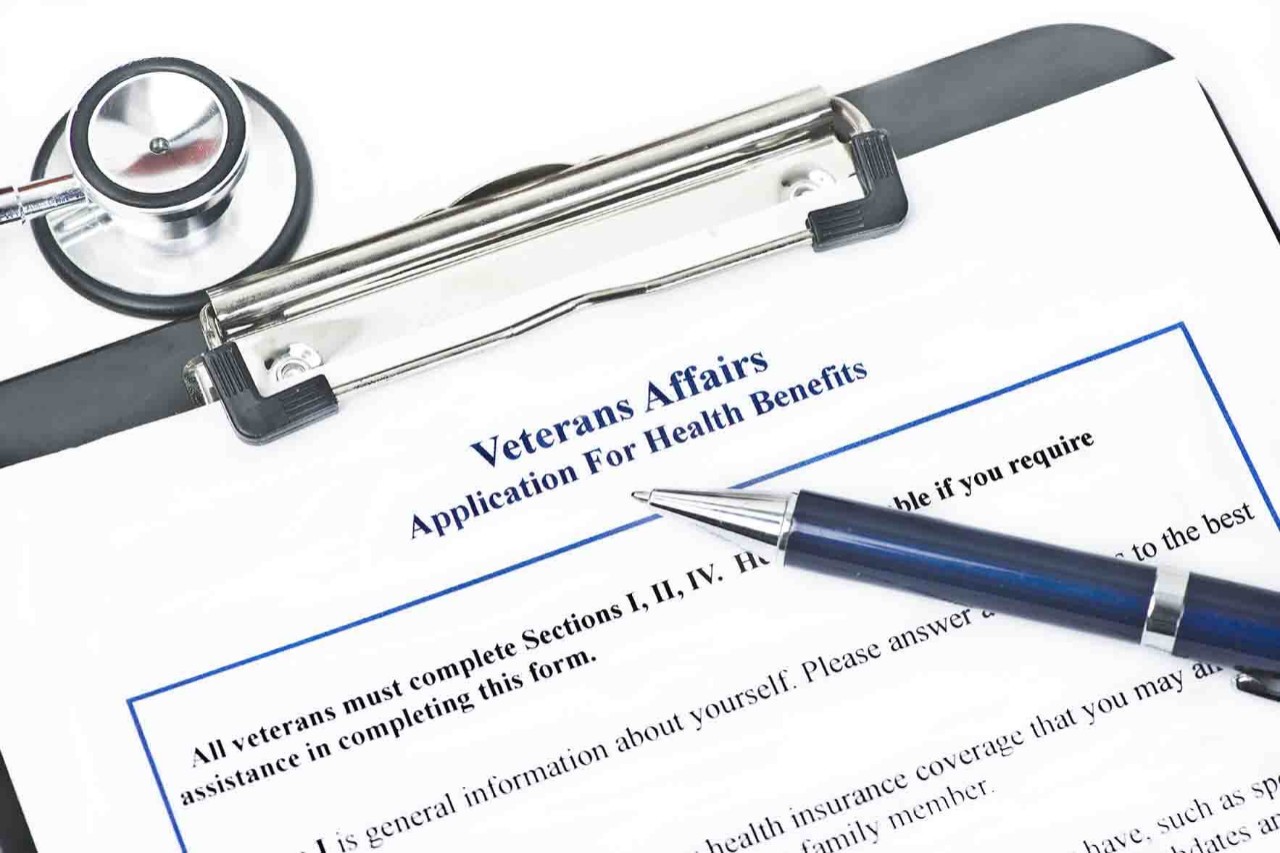 Application for Veteran Benefits on a clipboard